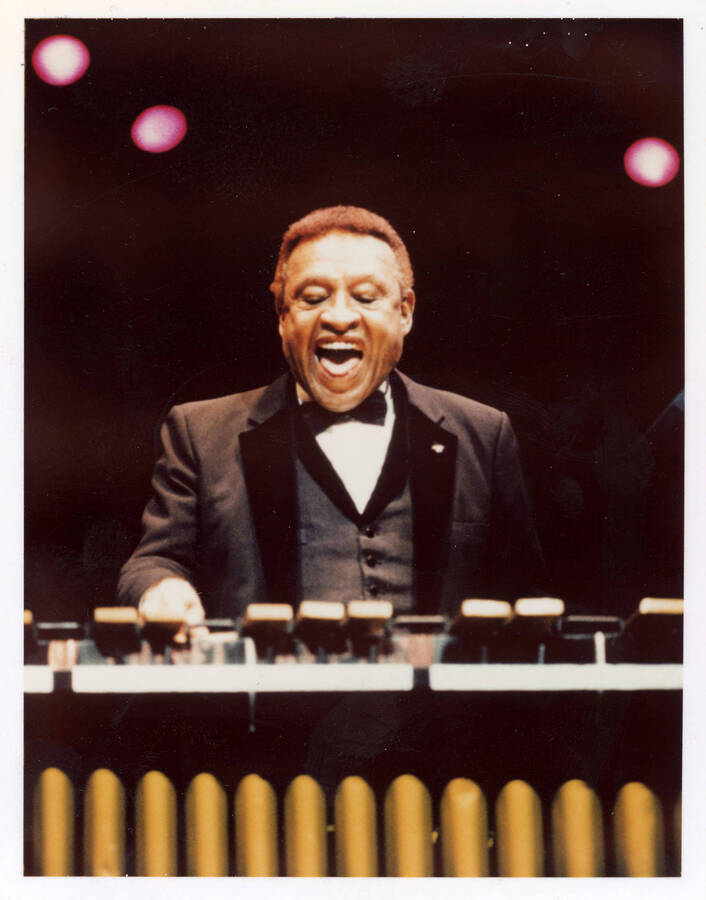 3.25" x 4.25 " color photograph. Lionel Hampton playing the vibes. Likely a promotional photograph used by Hampton.