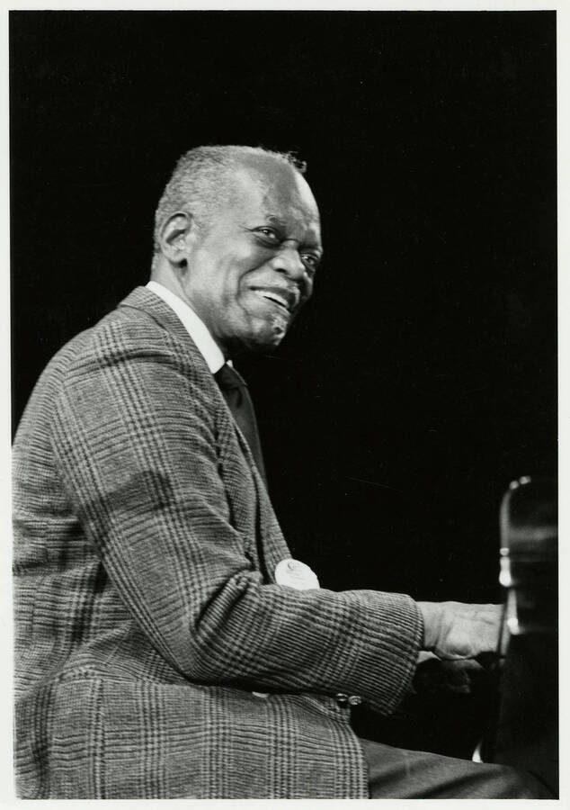 5" x 7" Hank Jones smiles while playing the piano at the Lionel Hampton Jazz Festival.