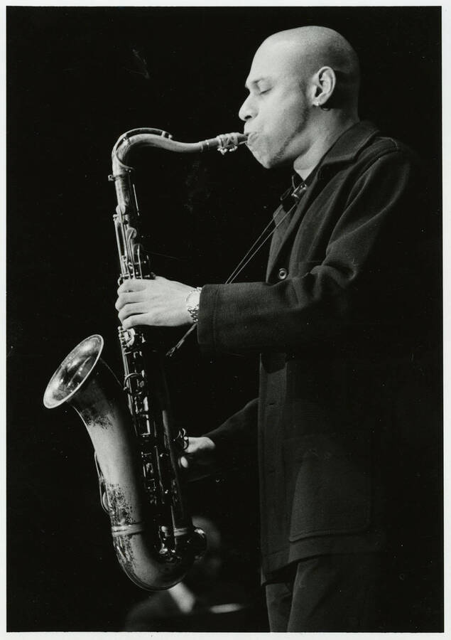 5" x 7" black and white photograph. Joshua Redman playing his saxophone at the Lionel Hampton Jazz Festival., profile view.