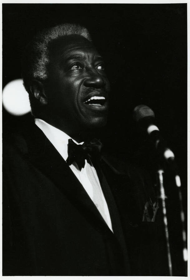 5" x 8" black and white photograph. Joe Williams sings at the jazz festival.