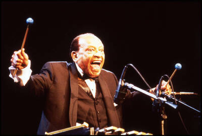 35mm color slide. Lionel Hampton holding vibraphone mallets.