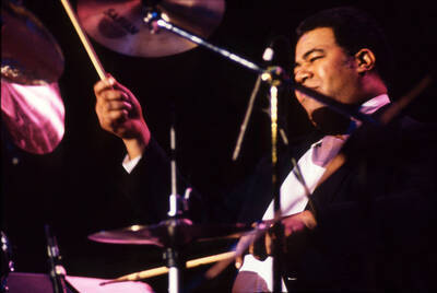 35 mm color slide. Wally "Gator" Watson plays drums at the Pepsi International World Jazz Night at the 1992 Lionel Hampton-Chevron Jazz Festival.