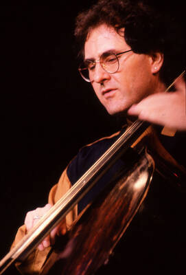 35mm color slide. Brian Bromberg plays bass at the Pepsi International World Jazz Night at the 1992 Lionel Hampton-Chevron Jazz Festival.