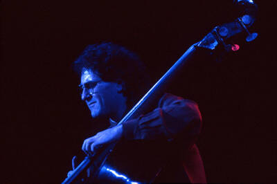35mm color slide. Brian Bromberg plays bass at the Pepsi International World Jazz Night at the 1992 Lionel Hampton-Chevron Jazz Festival.