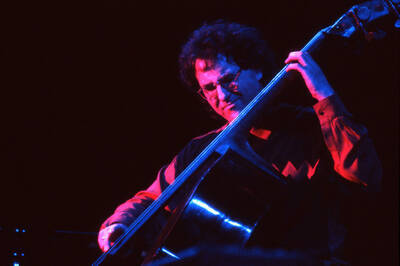 35mm color slide. Brian Bromberg plays bass at the Pepsi International World Jazz Night at the 1992 Lionel Hampton-Chevron Jazz Festival.