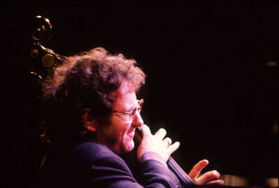 35mm color slide. Brian Bromberg plays bass at the Pepsi International World Jazz Night at the 1992 Lionel Hampton-Chevron Jazz Festival.