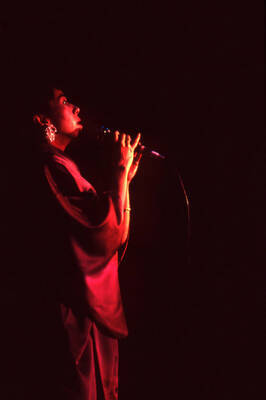 35 mm color slide. Reiko Aoki sings at the Pepsi International World Jazz Night at the 1992 Lionel Hampton-Chevron Jazz Festival wearing a kimono.