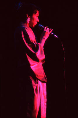 35 mm color slide. Reiko Aoki sings at the Pepsi International World Jazz Night at the 1992 Lionel Hampton-Chevron Jazz Festival wearing a kimono.