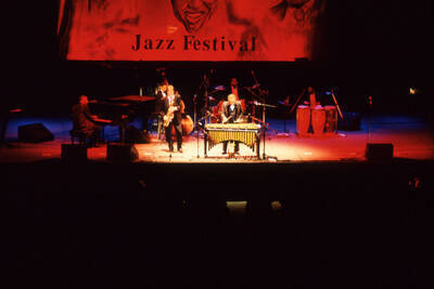 35 mm color slide. Lionel Hampton, Lembit Saarsalu, Leon Dorsey, Wally "Gator" Watson, Gabriel Machado and Leonid Vintskevich perform at the Pepsi International World Jazz Night at the 1992 Lionel Hampton-Chevron Jazz Festival evening concert.