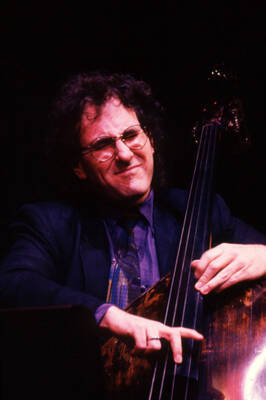 35mm color slide. Brian Bromberg plays bass at the Pepsi International World Jazz Night at the 1992 Lionel Hampton-Chevron Jazz Festival.