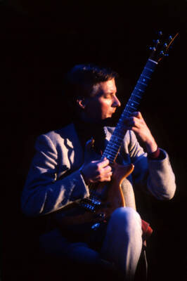 35 mm color slide. John Stowell plays guitar at the Pepsi International World Jazz Night at the 1992 Lionel Hampton-Chevron Jazz Festival.