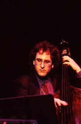 35mm color slide. Brian Bromberg plays bass at the Pepsi International World Jazz Night at the 1992 Lionel Hampton-Chevron Jazz Festival.