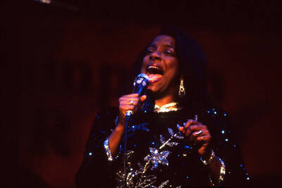 35 mm color slide. Kim Foley sings on stage at the Pepsi International World Jazz Night at the 1992 Lionel Hampton-Chevron Jazz Festival.