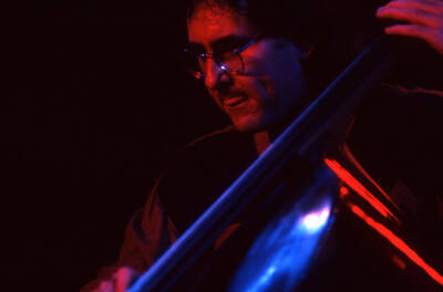 35mm color slide. Brian Bromberg plays bass at the Pepsi International World Jazz Night at the 1992 Lionel Hampton-Chevron Jazz Festival.
