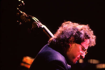 35mm color slide. Brian Bromberg plays bass at the Pepsi International World Jazz Night at the 1992 Lionel Hampton-Chevron Jazz Festival.