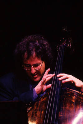 35mm color slide. Brian Bromberg plays bass at the Pepsi International World Jazz Night at the 1992 Lionel Hampton-Chevron Jazz Festival.