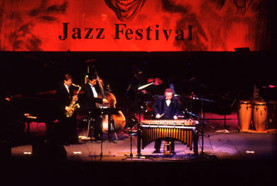 35 mm color slide. Lionel Hampton, Lembit Saarsalu, Leon Dorsey, Wally "Gator" Watson, Gabriel Machado and Leonid Vintskevich perform at the Pepsi International World Jazz Night at the 1992 Lionel Hampton-Chevron Jazz Festival evening concert.
