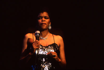 35 mm color slide. Lisa Capers on stage at the Pepsi International World Jazz Night at the 1992 Lionel Hampton-Chevron Jazz Festival.