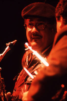 35mm color slide. Paquito D'Rivera and Claudio Roditi talk on stage at the Pepsi International World Jazz Night at the 1992 Lionel Hampton-Chevron Jazz Festival.