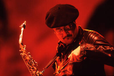 35mm color slide. Paquito D'Rivera checks his shirt pocket on stage at the Pepsi International World Jazz Night at the 1992 Lionel Hampton-Chevron Jazz Festival.