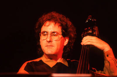 35mm color slide. Brian Bromberg plays bass at the Pepsi International World Jazz Night at the 1992 Lionel Hampton-Chevron Jazz Festival.