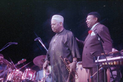 35mm color negative. Lionel Hampton and Dizzy Gillespie stand on stage at the 1991 Lionel Hampton-Chevron Jazz Festival.