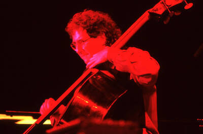 35mm color slide. Brian Bromberg plays bass at the Pepsi International World Jazz Night at the 1992 Lionel Hampton-Chevron Jazz Festival.