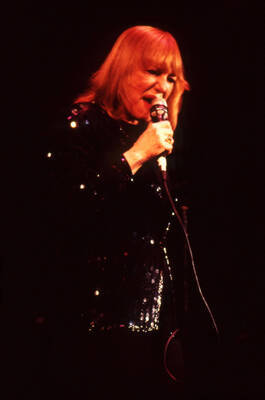 35 mm color slide. Gail Wynters sings on stage at the Pepsi International World Jazz Night at the 1992 Lionel Hampton-Chevron Jazz Festival.