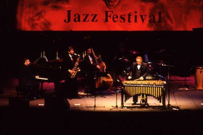 35 mm color slide. Lionel Hampton, Lembit Saarsalu, Leon Dorsey, Wally "Gator" Watson, and Leonid Vintskevich perform at the Pepsi International World Jazz Night at the 1992 Lionel Hampton-Chevron Jazz Festival evening concert. Gabriel Machado on conga not pictured.