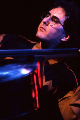 35mm color slide. Brian Bromberg plays bass at the Pepsi International World Jazz Night at the 1992 Lionel Hampton-Chevron Jazz Festival.