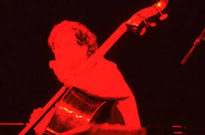 35mm color slide. Brian Bromberg plays bass at the Pepsi International World Jazz Night at the 1992 Lionel Hampton-Chevron Jazz Festival.