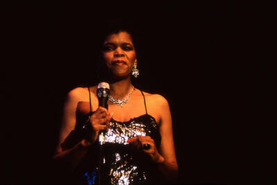 35 mm color slide. Lisa Capers on stage at the Pepsi International World Jazz Night at the 1992 Lionel Hampton-Chevron Jazz Festival.