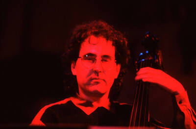 35mm color slide. Brian Bromberg plays bass at the Pepsi International World Jazz Night at the 1992 Lionel Hampton-Chevron Jazz Festival.