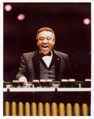 3.25" x 4.25 " color photograph. Lionel Hampton playing the vibes. Likely a promotional photograph used by Hampton.