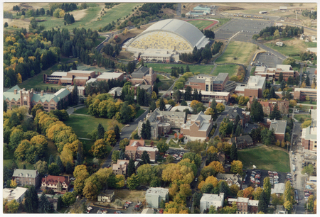 Color aerial photograph of the University of Idaho campus, including various academic and sports buildings.