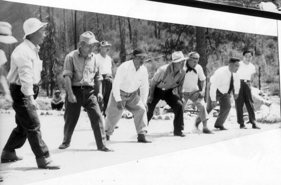Image of men lined up for a footrace at Kooskia Internment Camp. Photo taken from 12-3/4 x 15-1/4 Photograph album of the Kooskia Japanese Internment Camp.