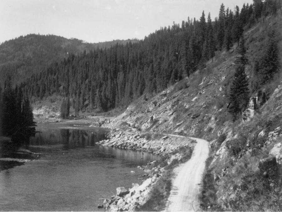 Image of road beside the Lochsa Lochsa River near the Kooskia Internment Camp. Photo taken from 12-3/4 x 15-1/4 Photograph album of the Kooskia Japanese Internment Camp.