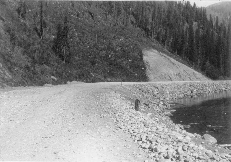Image of gravel road next to the Lochsa River near Kooskia Internment Camp. Photo taken from 12-3/4 x 15-1/4 Photograph album of the Kooskia Japanese Internment Camp.