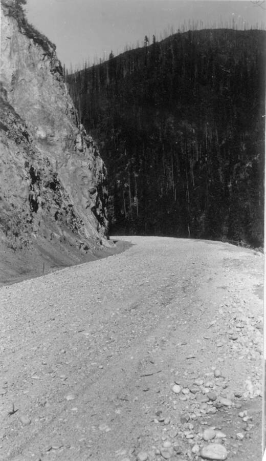 Image of gravel road after construction near Kooskia Internment Camp. Photo taken from 12-3/4 x 15-1/4 Photograph album of the Kooskia Japanese Internment Camp.