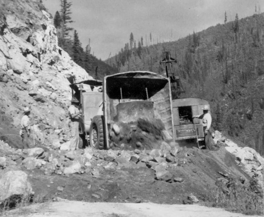 Image of construction equipment moving dirt at Kooskia Internment Camp. Photo taken from 12-3/4 x 15-1/4 Photograph album of the Kooskia Japanese Internment Camp.