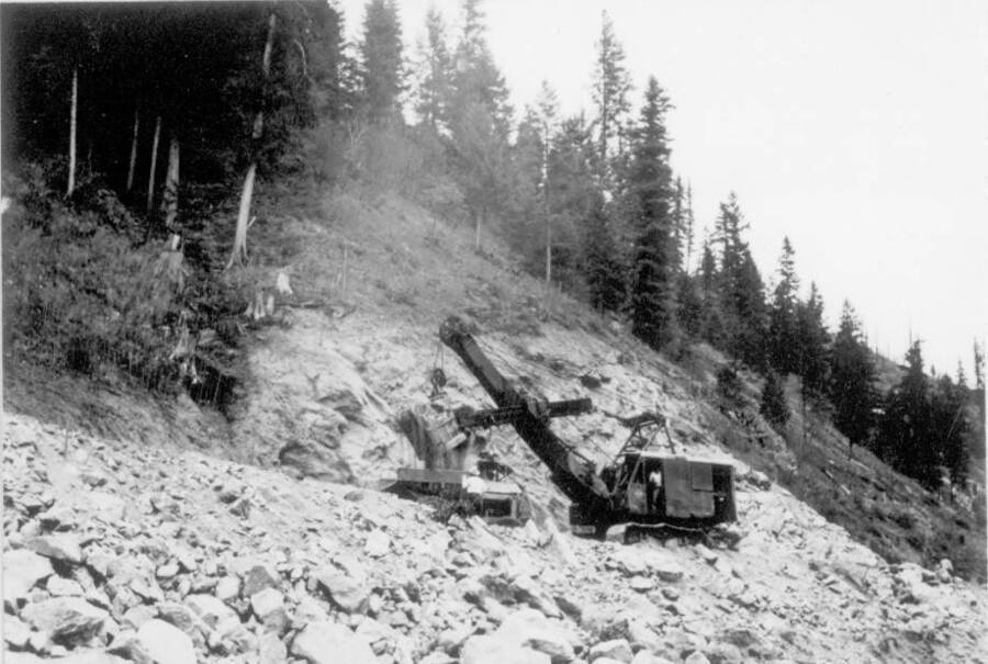 Image of construction machinery on hillside at Kooskia Internment Camp. Photo taken from 12-3/4 x 15-1/4 Photograph album of the Kooskia Japanese Internment Camp.