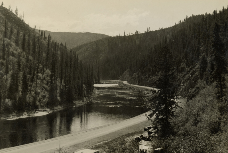 A black and white photograph of the Lochsa river and a road.