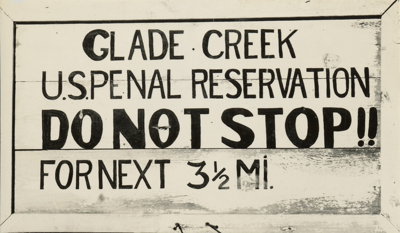 A black and white image of a sign. It reads "Glade Creek U.S. Penal Reservation. DO NOT STOP!! For next 3 1/2 miles". 