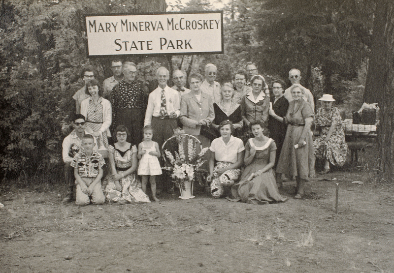 Group of people in front of the Mary Minerva McCroskey State Park sign. 