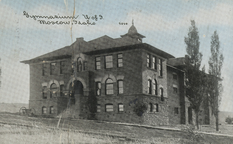 Historic image of the University of Idaho Gymnasium and Armory. Note the canon at the front of the building.