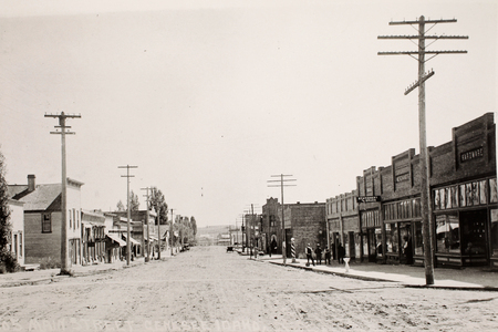 Historic image of the Driscoll Block (right side of street).