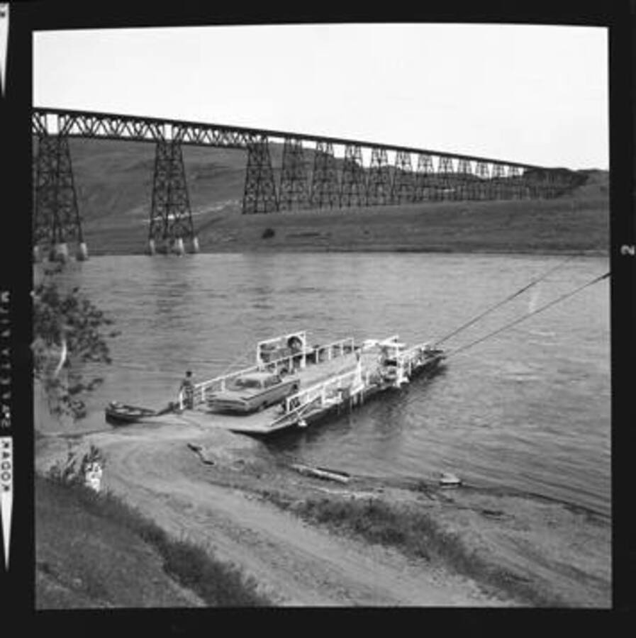 View of the Union Pacific trestle and a car ferry on the Snake Rive at Lyons Ferry.