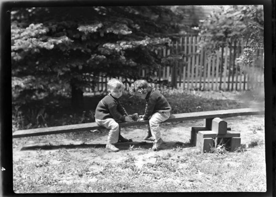 Picture of Helen and John Laughlin playing on a seesaw
