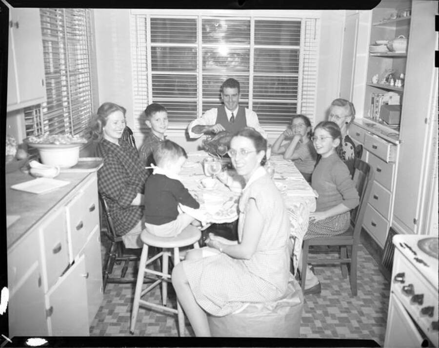 Kyle Laughlin family with guests at Christmas dinner