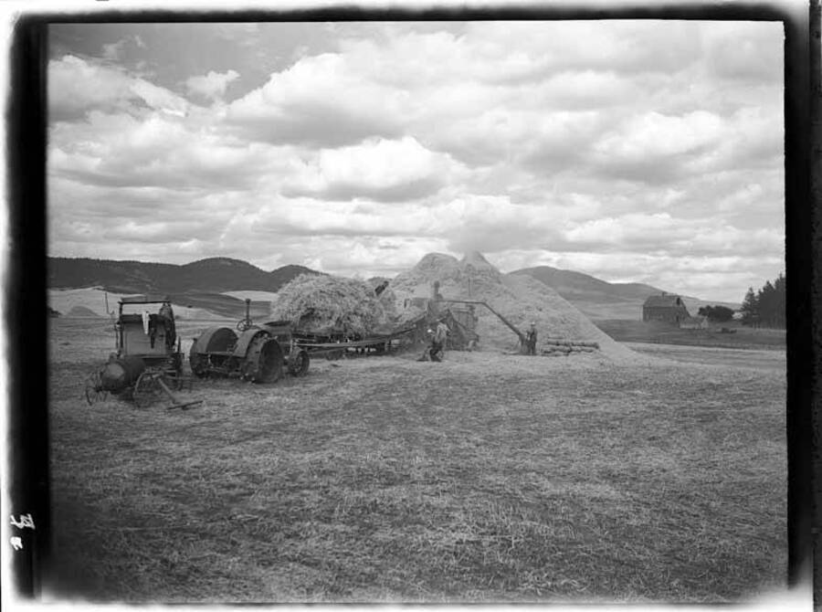 Image shows harvest scenes showing threshing in the Palouse region of Idaho.